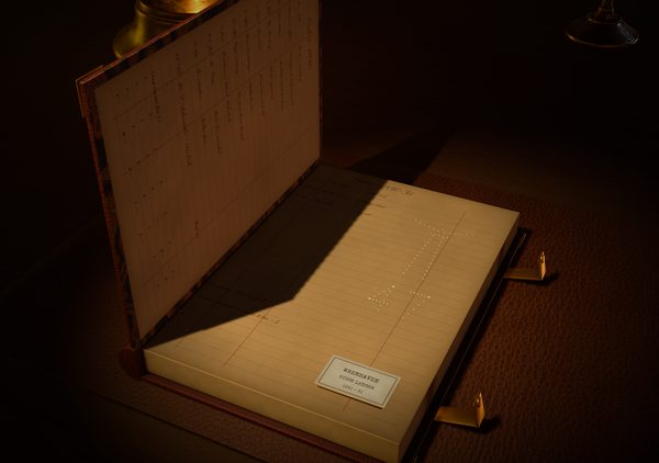 iPhone Duo: the locksmith's ledger standing like a laptop, the lamp shining through